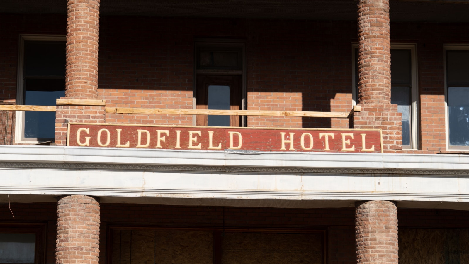 Exterior view of the Goldfield Hotel sign in Goldfield Nevada. The hotel is abandoned and supposedly haunted. July 4 2018 - Goldfield, NV