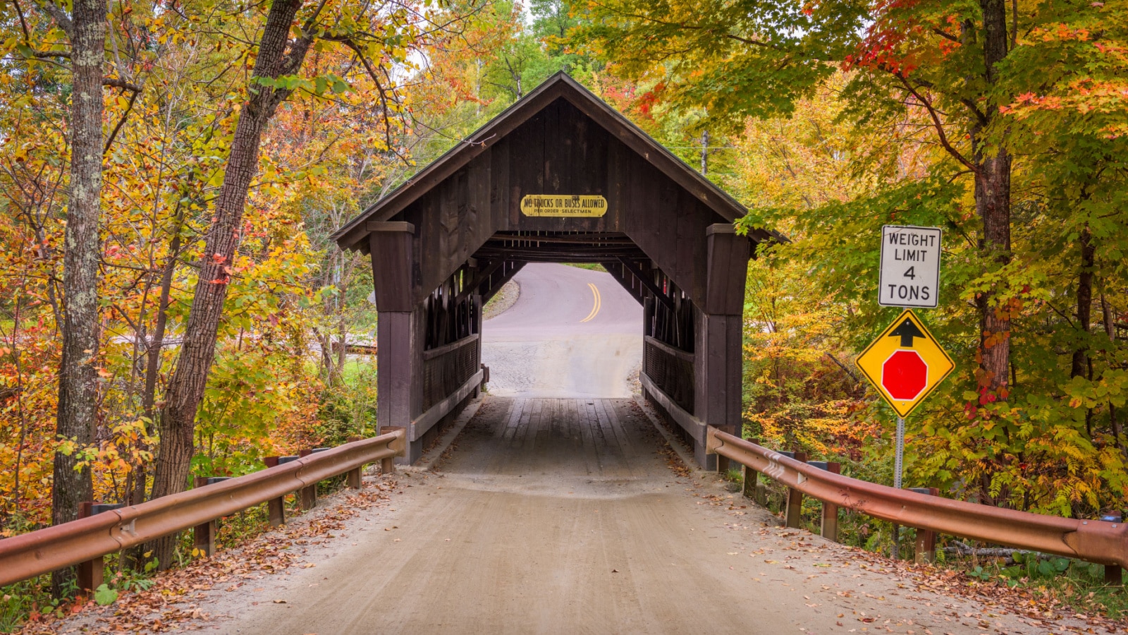 Stowe, Vermont, USA at Emily's Bridge with fall colors.