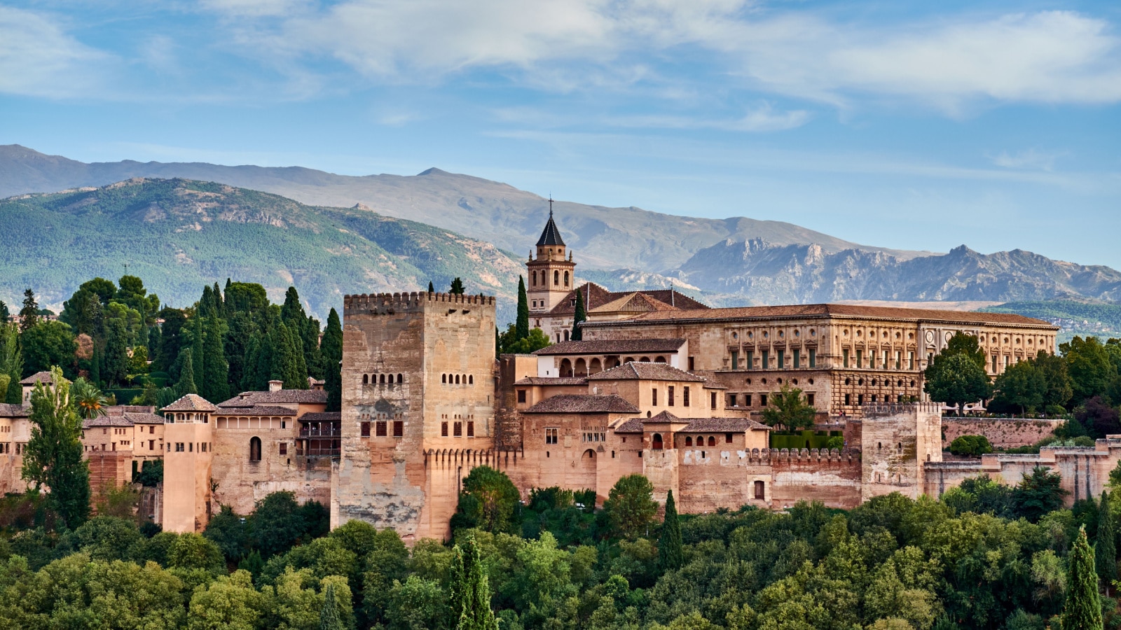 Ancient arabic fortress Alhambra at the beautiful evening time, Granada, Spain, European travel landmark