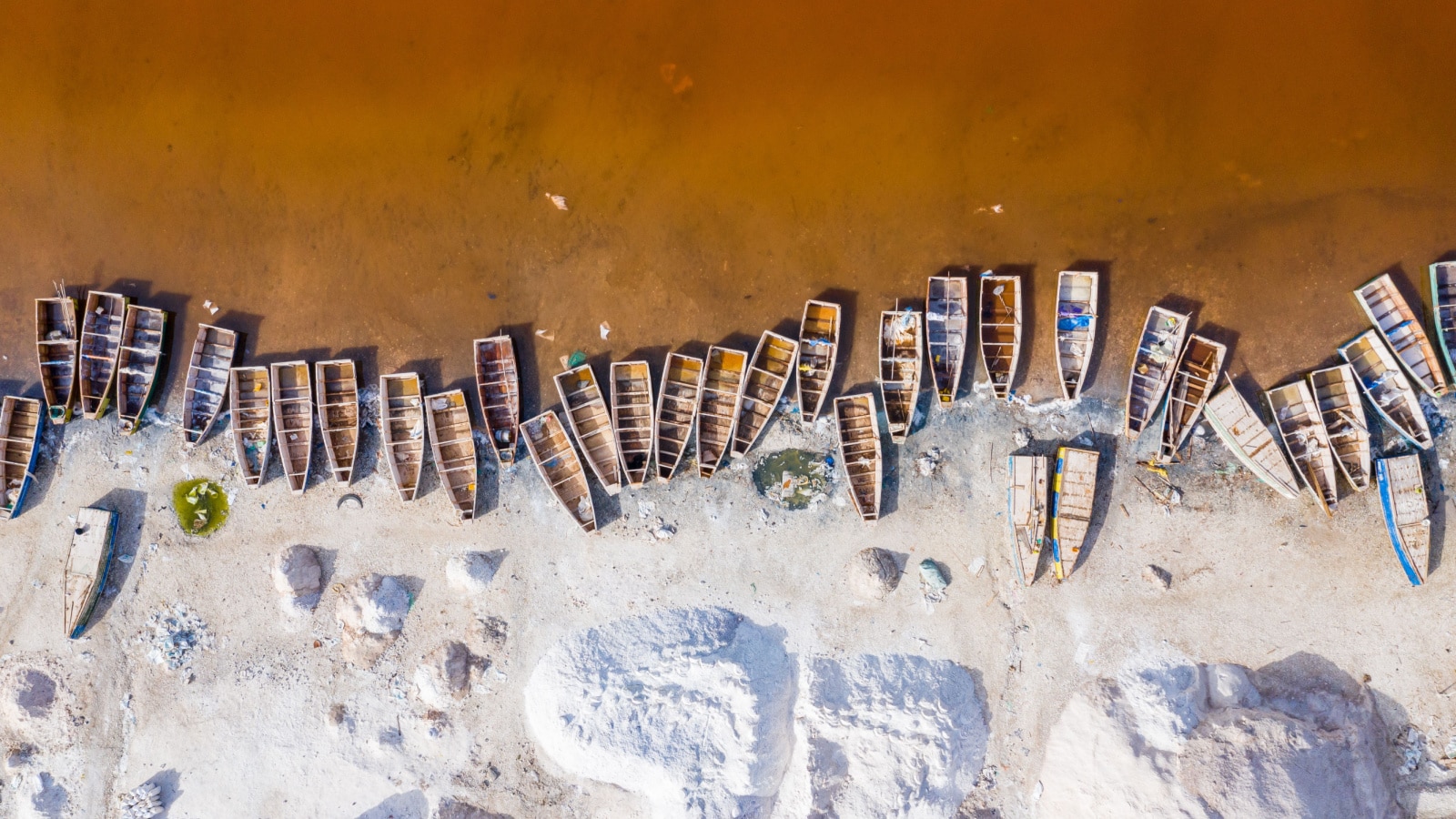 Aerial view of the Pink Lake Retba or Lac Rose in Senegal. Photo made by drone from above. Africa Natural Landscape.