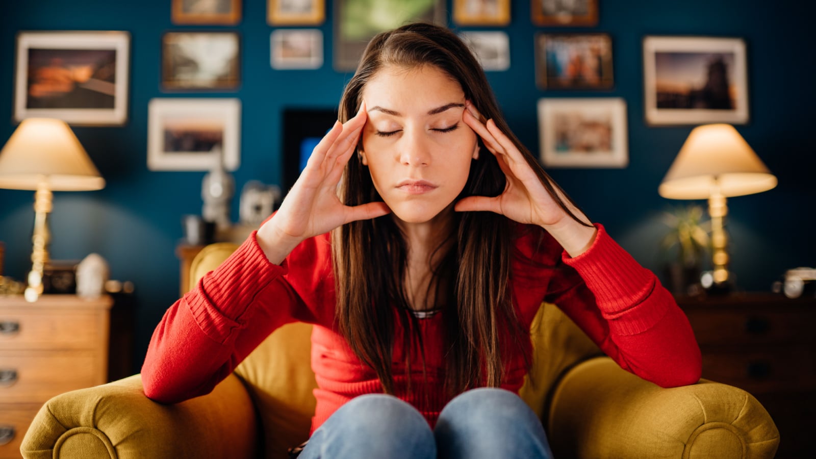 Stressed woman overthinking events alone at home.Thinking of problems.Concentration problems.Brain/cognitive/neurological activity stimulation.Memory loss.Headache,migraine,high blood pressure,anxiety