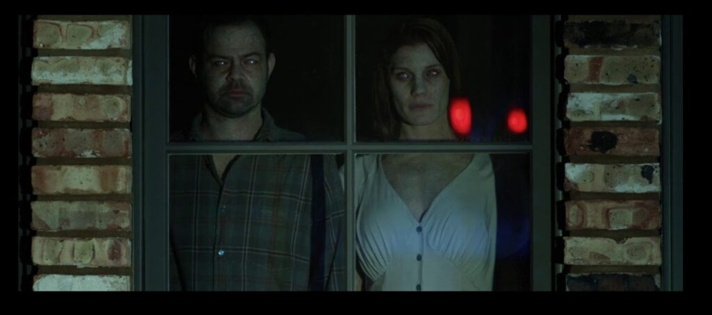 Rory Cochrane and Katee Sackhoff in Oculus (2013)