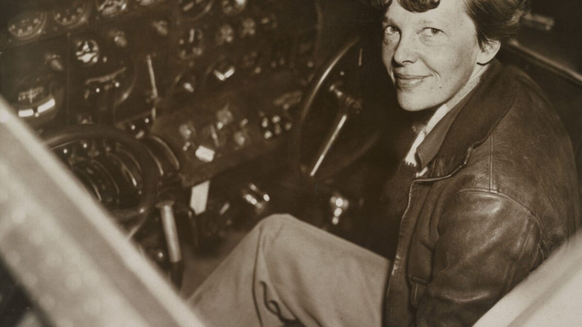 Amelia Earhart sitting in the cockpit of her Lockheed Electra airplane, ca. 1936. In July 1937 Earhart and the airplane were lost over the Pacific Ocean.