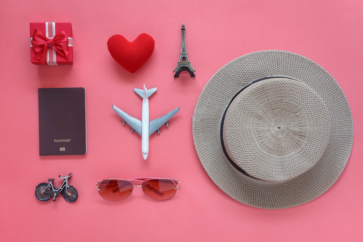 Flat lay aerial image of travel background concept.Table top view of souvenir symbol location or landmark of place for traveler at Paris France.objects on rustic pink wooden.