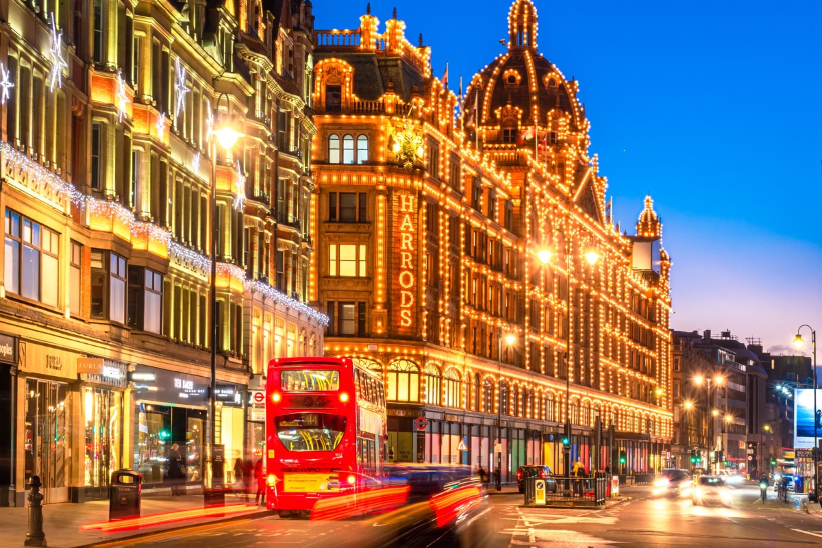 London, England, UK - December 27, 2020: Harrods luxury building in London illuminated at dusk to down