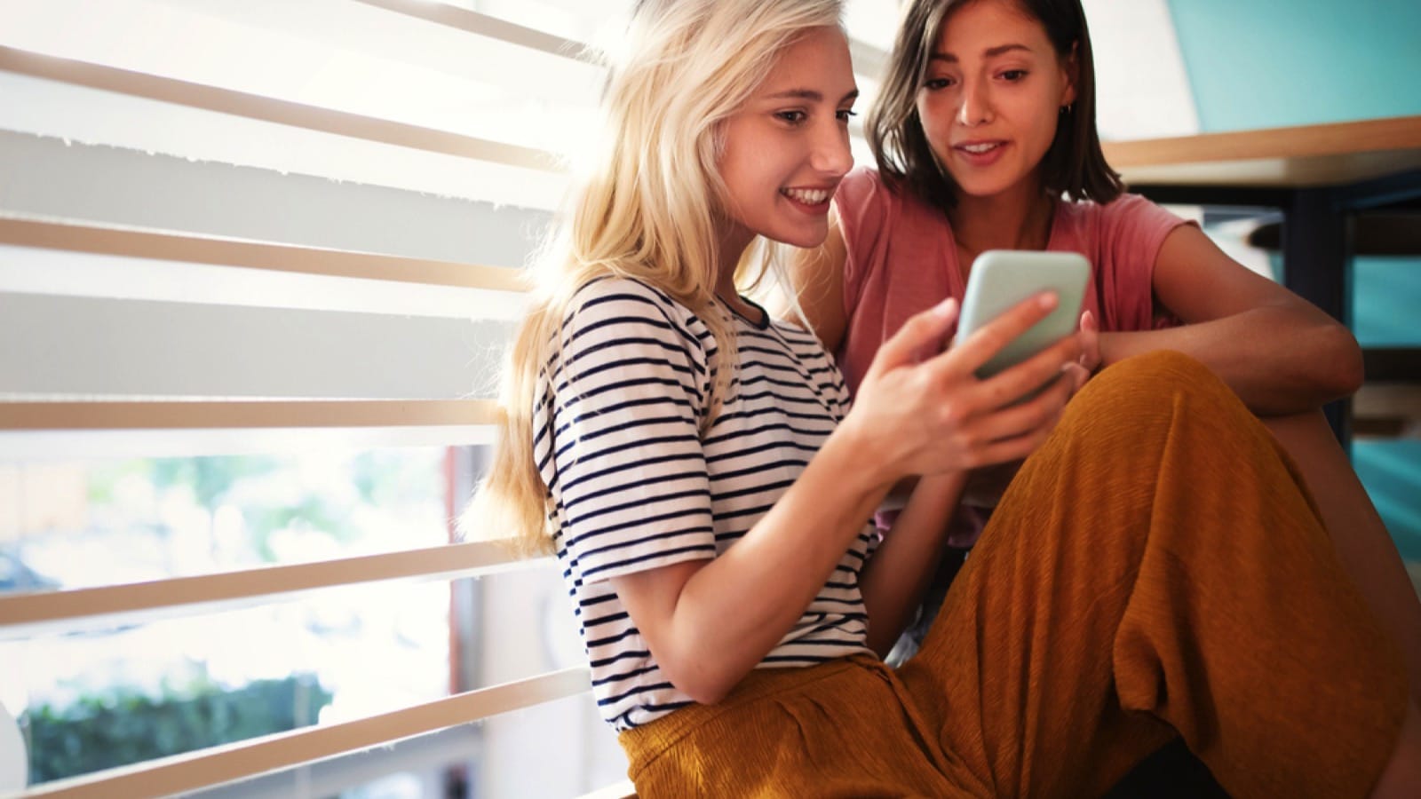 Two woman with mobile