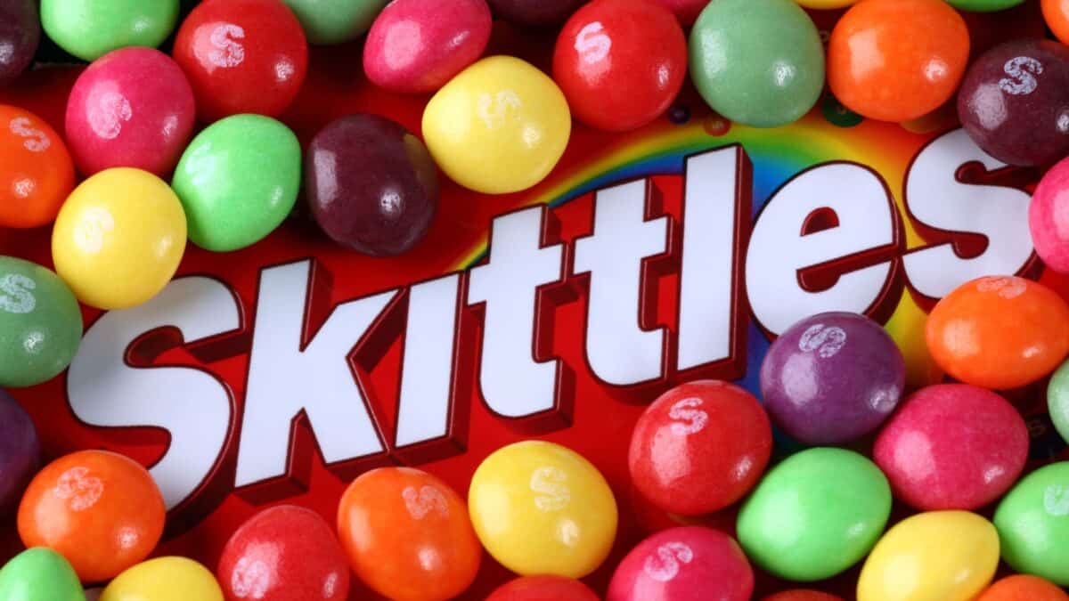 Tambov, Russian Federation - September 2, 2012: Skittles Candy on Skittles brand. Skittles is a fruit-flavoured sweets, produced by the Wm. Wrigley Jr. Company (division of Mars, Inc).