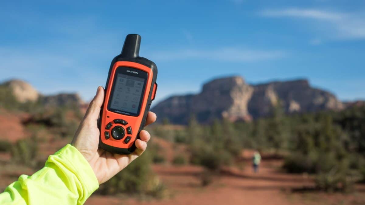 Sedona, Arizona / USA - April 15, 2019: A woman holds a Garmin inReach Explorer+ 2-Way Satellite Communicator, which has a GPS signal anywhere in the world.