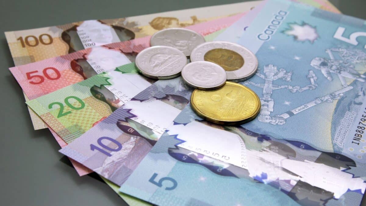 Canadian money, Currency of Canada. Stack of cash Canadian dollars on dark background.