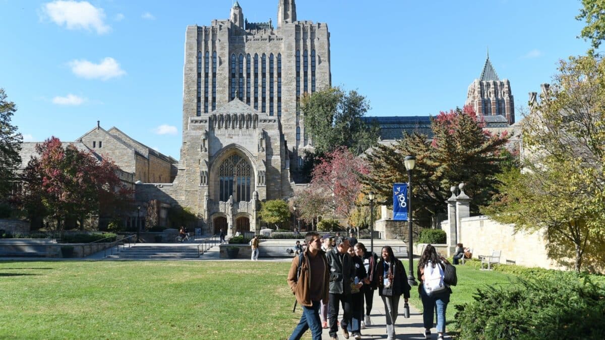 People walk near the Sterling Memorial Libray at Yale University on November 2, 2023 in New Haven, USA. The Sterling Memorial Library (SML) is the main library of the Yale University.