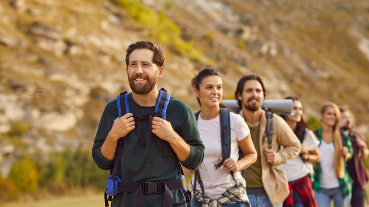 Embark on a mountain adventure with this group of friends. As a cohesive team of hikers and tourists, explore the majestic peaks, creating unforgettable memories during exciting vacation trip.