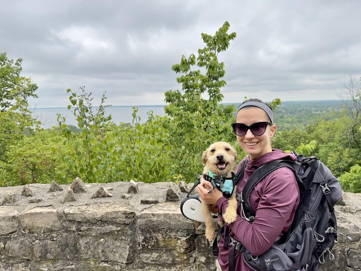 Buddy and Lindsey smiling at the camera after a hike