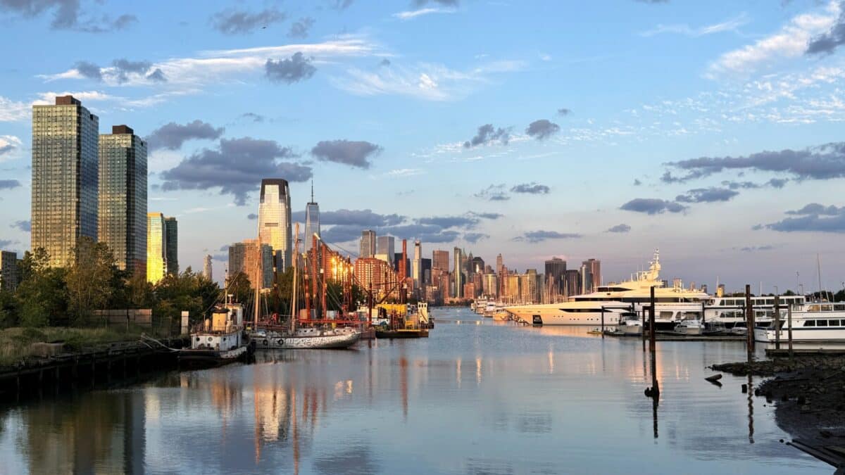 Jersey City, NJ, USA - August 12 2024: Jersey City and Lower Manhattan New York City at Sunset