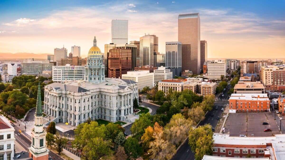 Aerial view of Colorado Capitol and Denver, Colorado skyline at sunset. Denver is a consolidated city and county, the capital, and most populous city of the U.S. state of Colorado