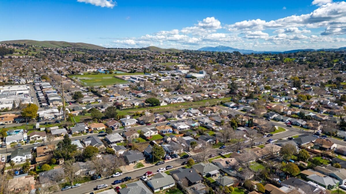 Aerial Photos over a community in Vallejo, California with houses, streets, cars and parks