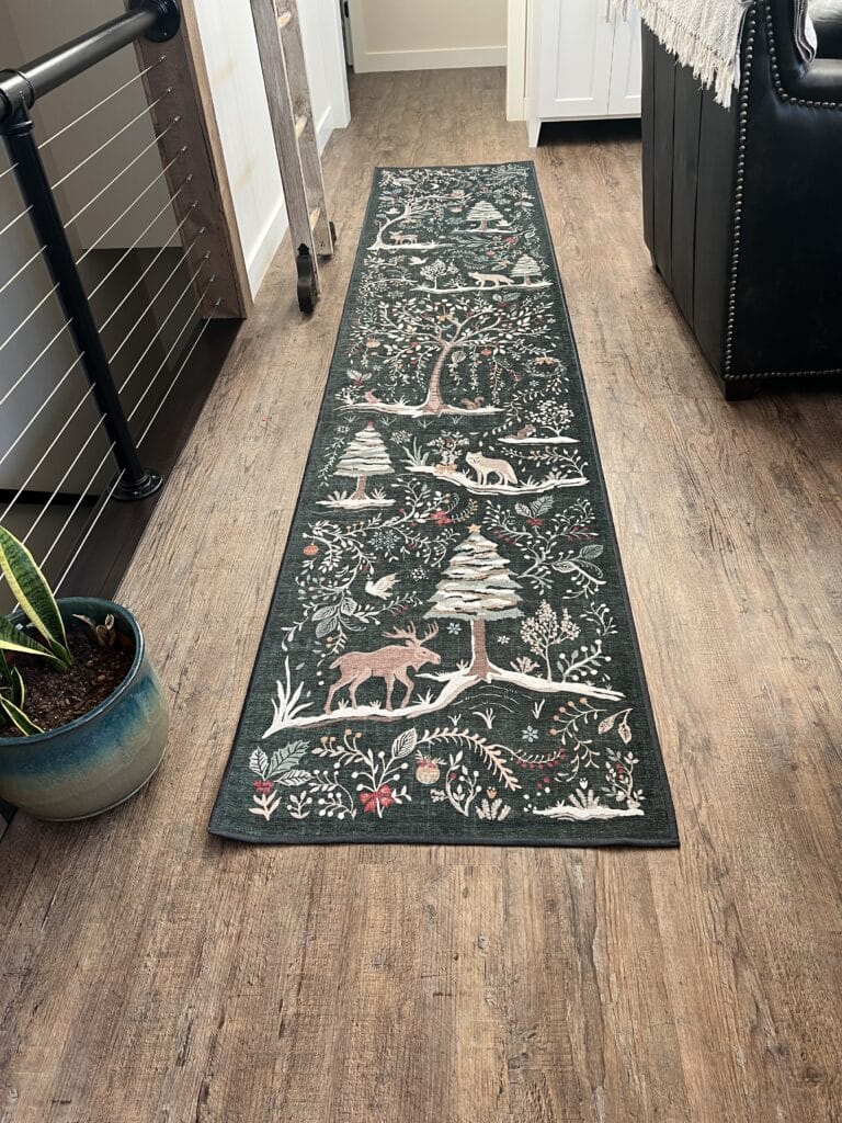 A Christmas rug by Ruggable on a wood floor