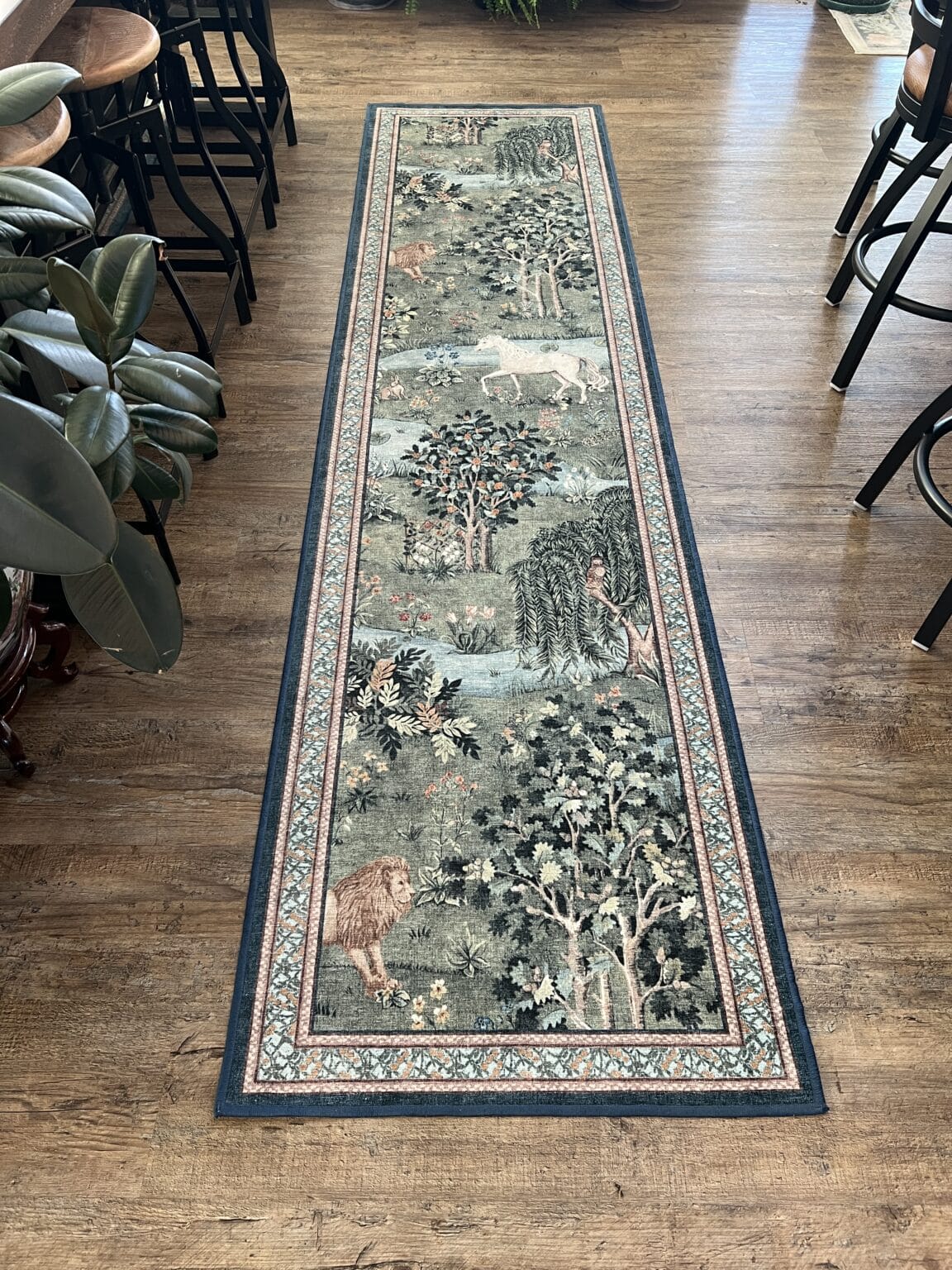 The green Morris & Co owl runner rug