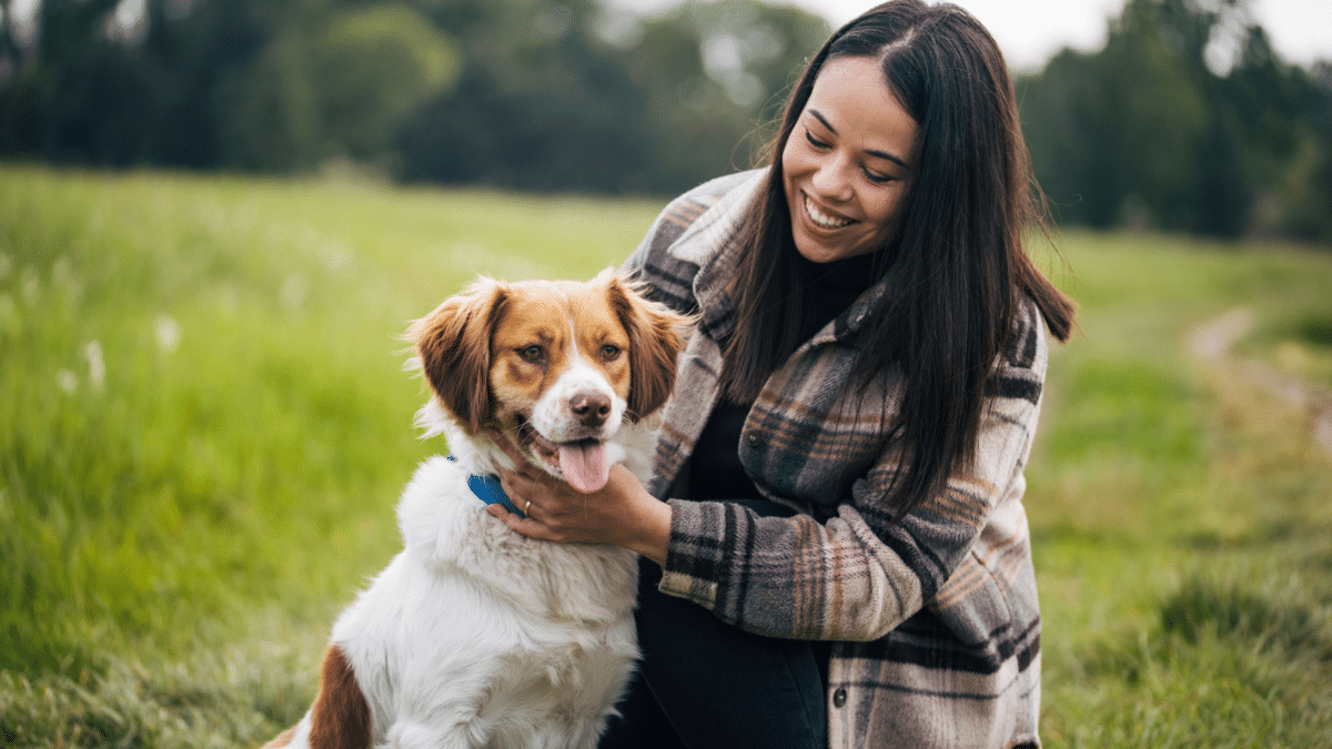 Dog and owner in trail