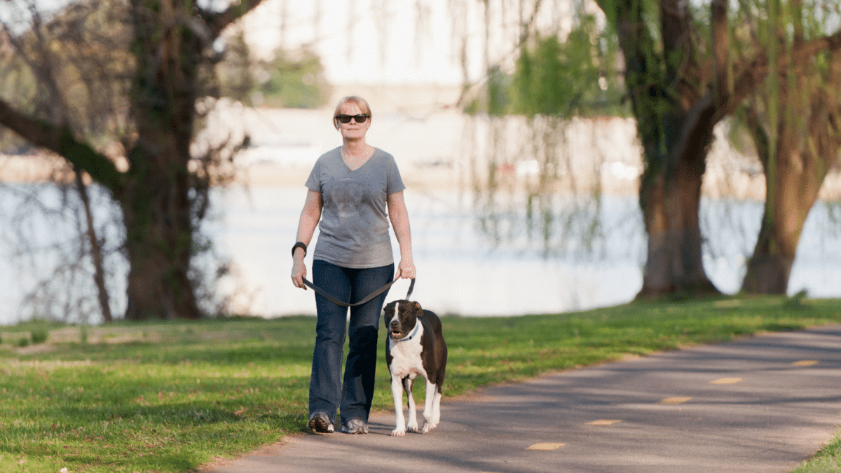 Woman walking dog in Washington D.C. park