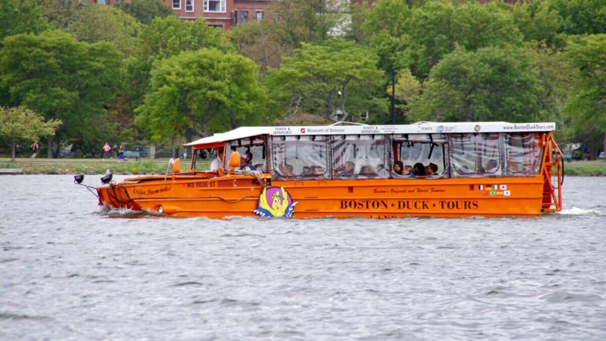 Boston, MA, USA. September 30, 2016. Orange Boston Duck Tours D.U.K.W Amphibian Vehicle, Olga Ironsides, on The Charles River.