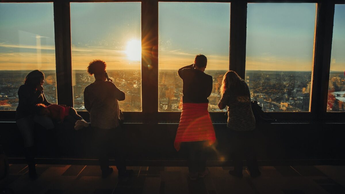 BOSTON MA, USA - November 11, 2017: people take pictures of the sunset from the window. people in Skywalk Observatory on top of the Prudential Tower in Boston